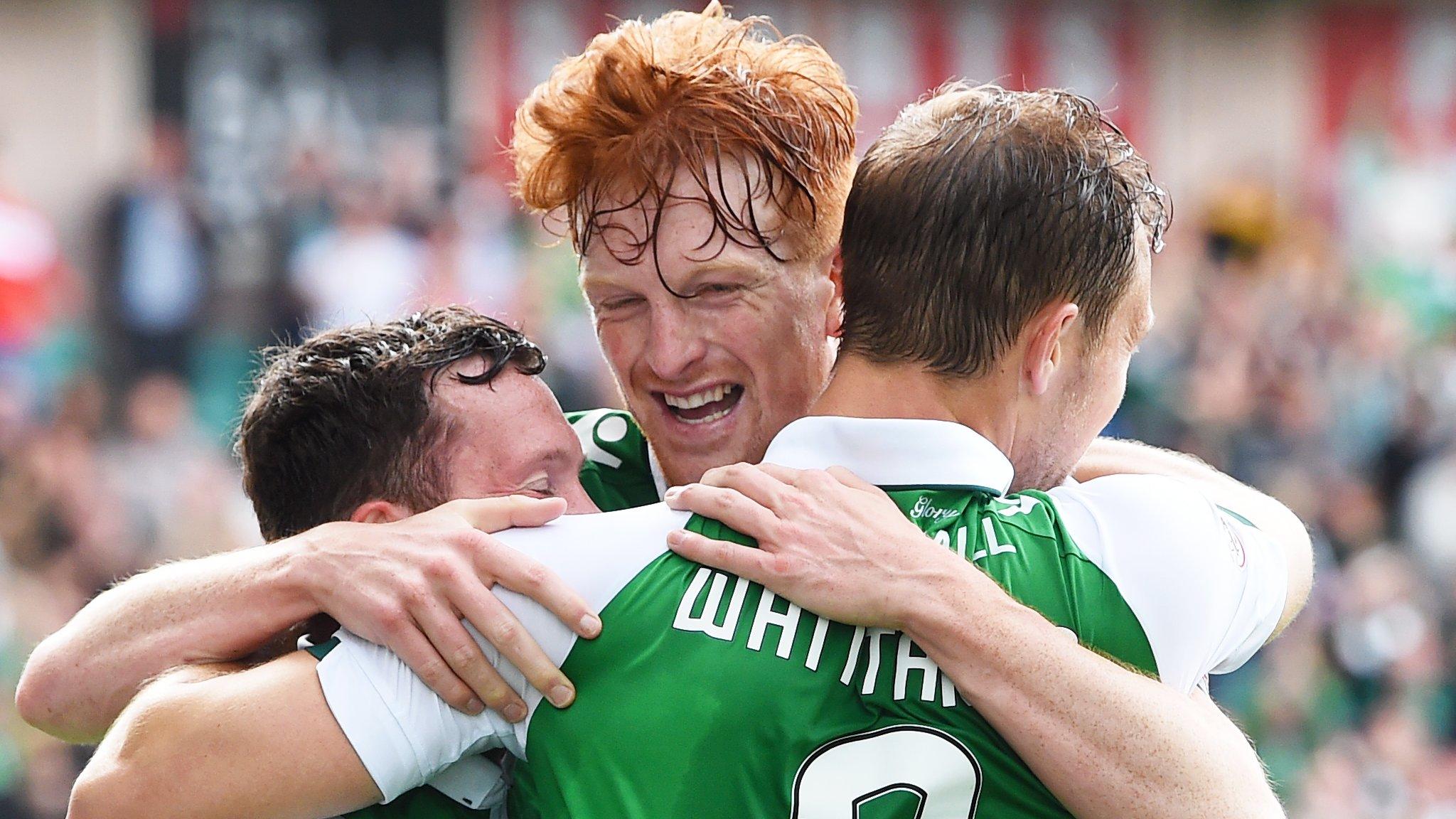 Simon Murray (centre), who scored Hibs' third goal, helps Steven Whittaker celebrate his goal