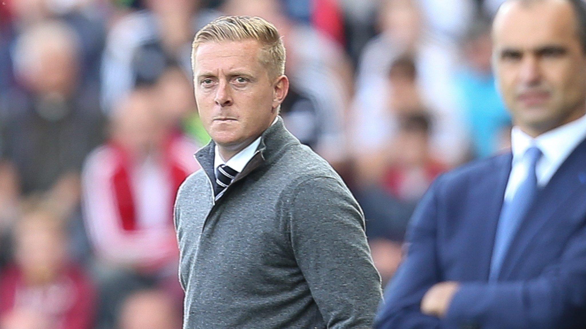 Garry Monk (left) and Roberto Martinez