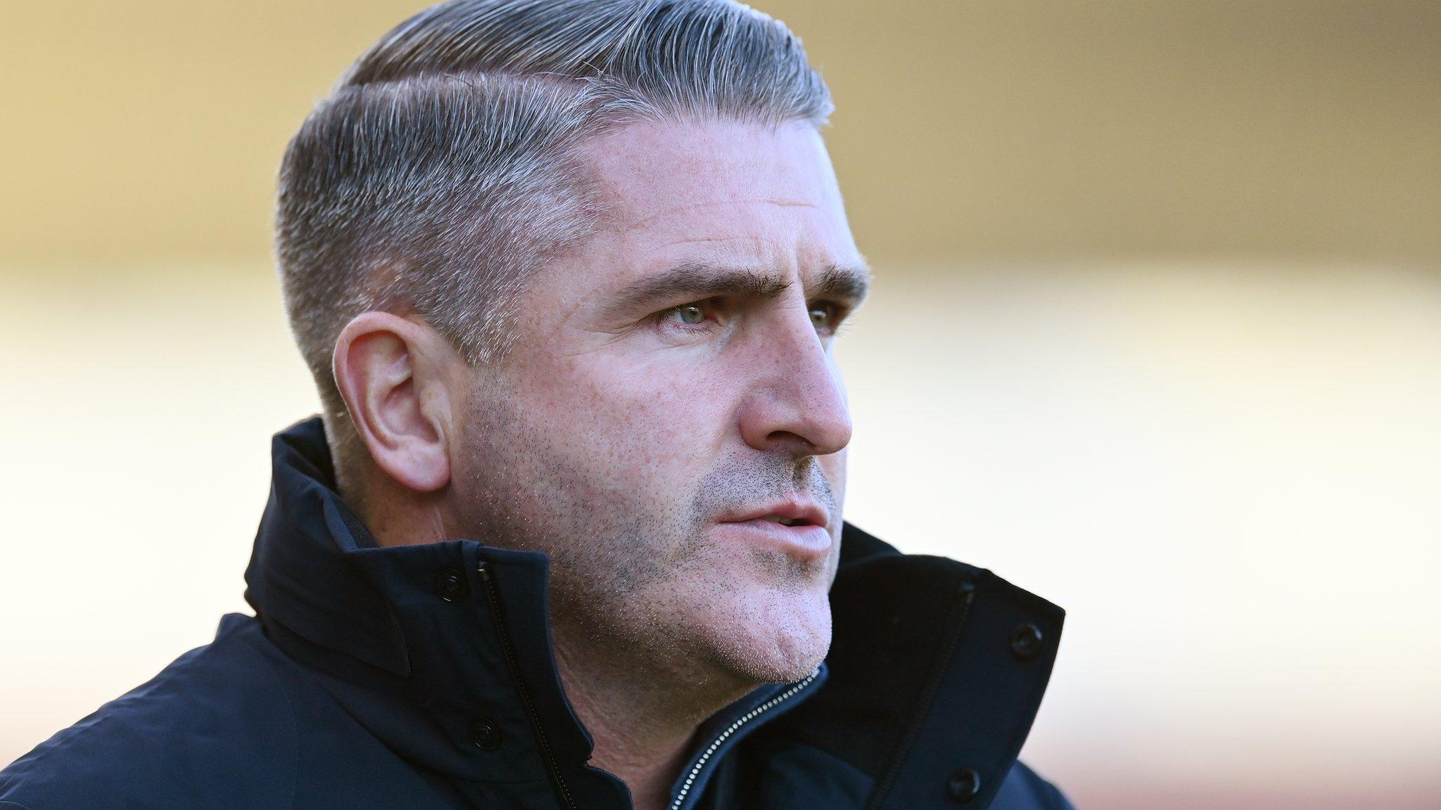 Ryan Lowe looks on