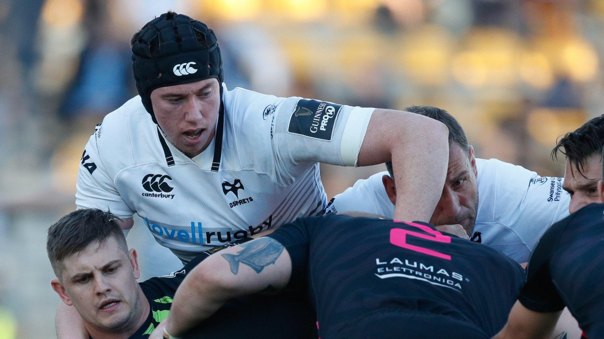 Ospreys' Adam Beard tries to halt the Zebre forwards