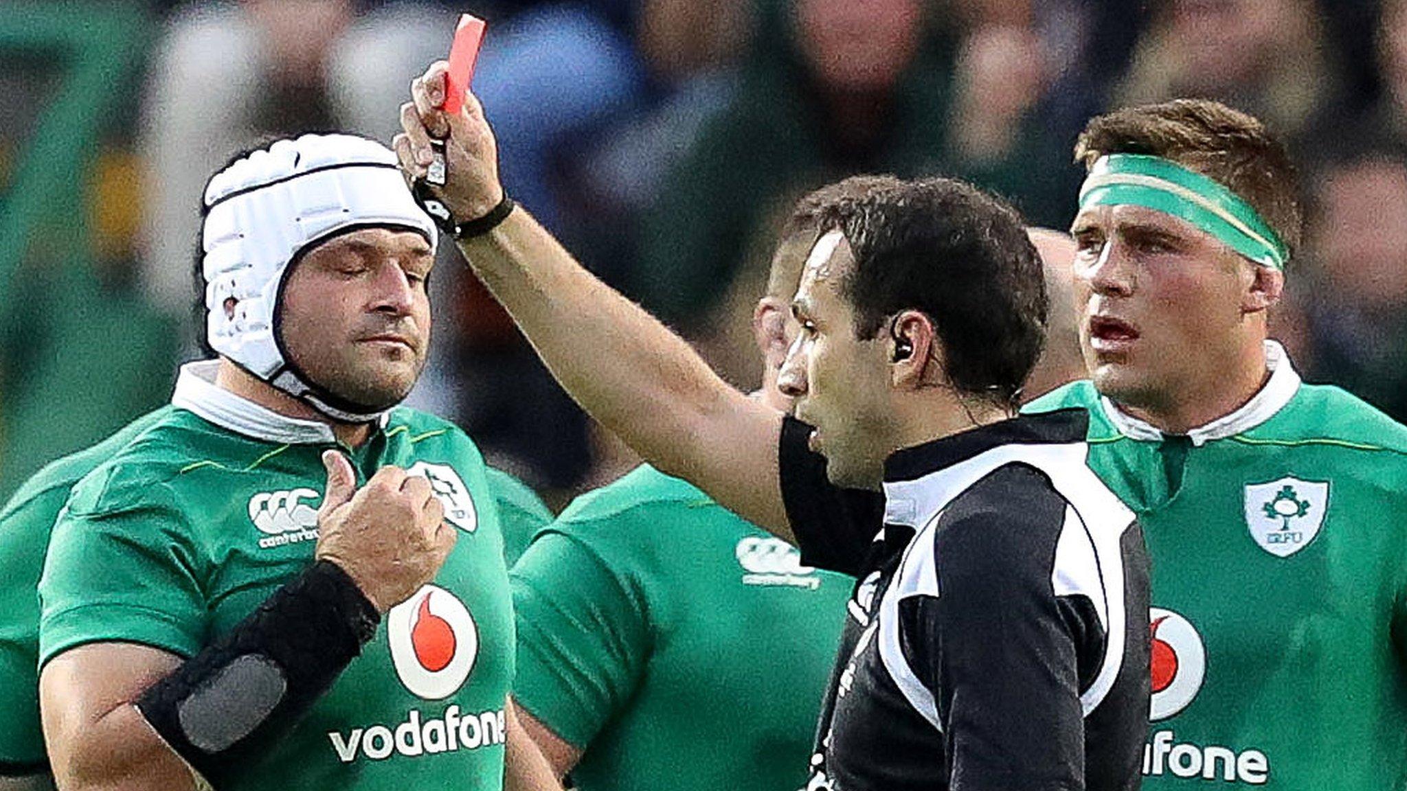 Ireland captain Rory Best (left) shows his disappointment as Stander (right) is sent off by referee Mathieu Raynal