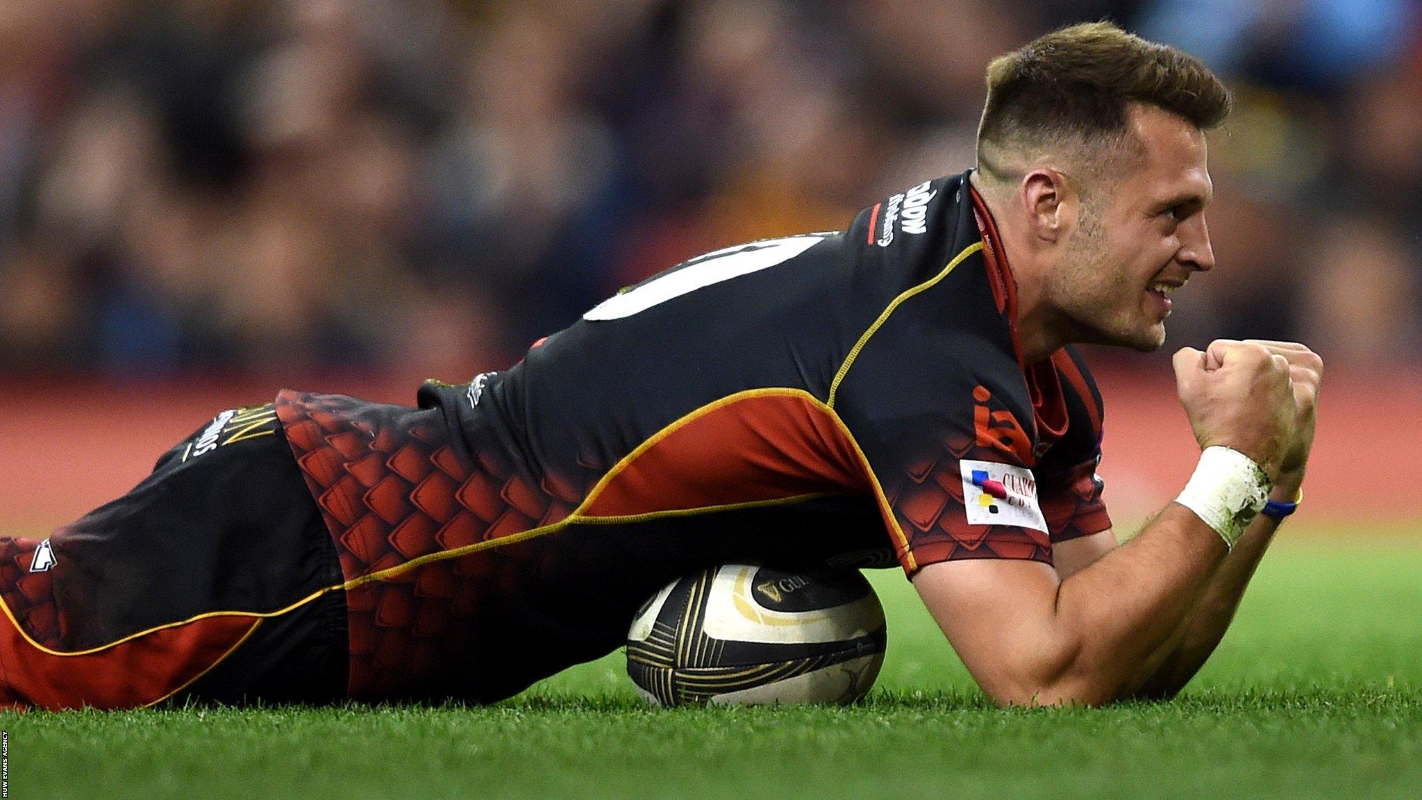Dragons fly-half Josh Lewis celebrates his try