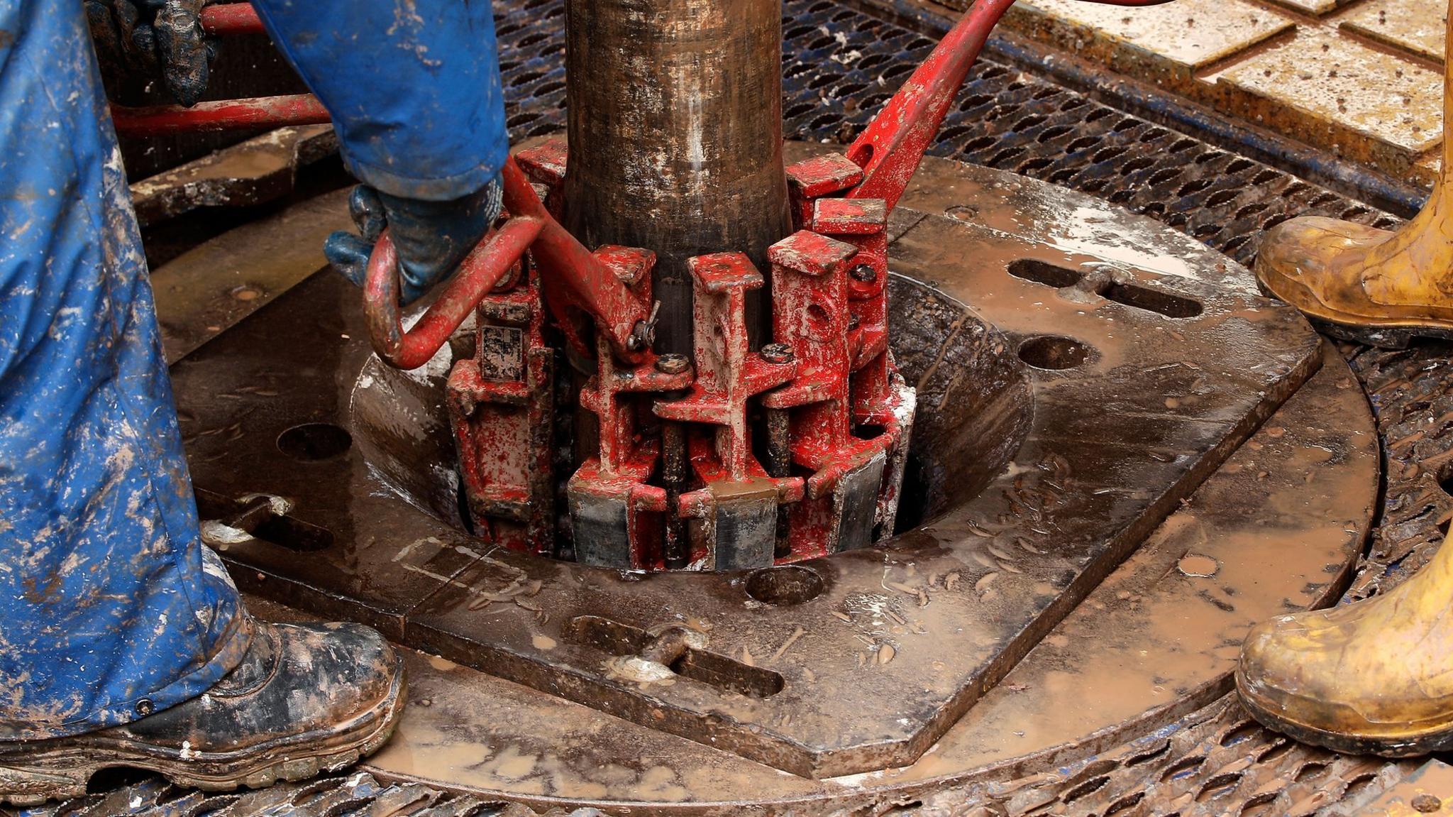 Engineers on the drilling platform of a fracking facility