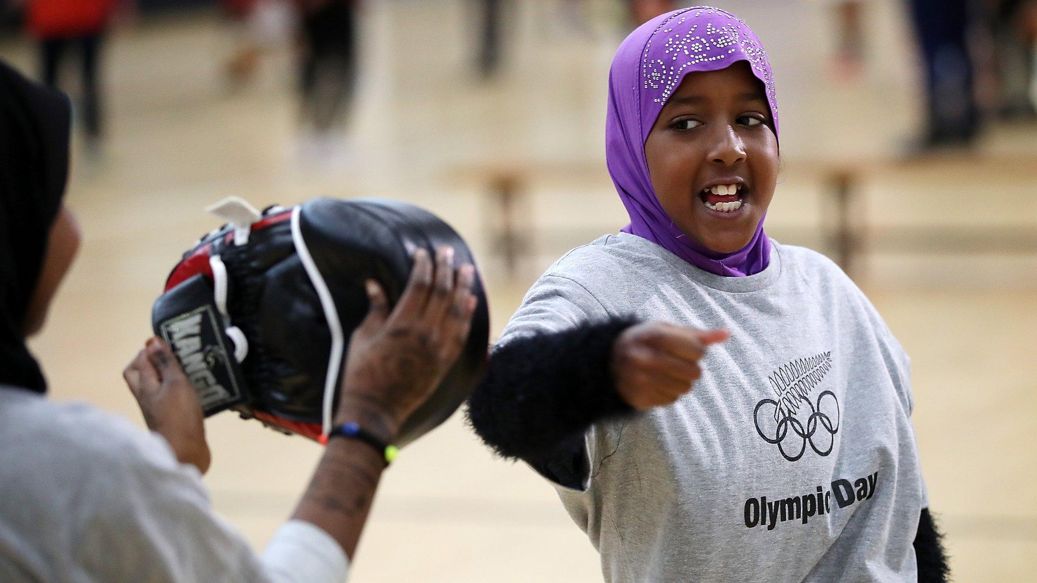 AUCKLAND, NEW ZEALAND - JUNE 19: Hibo Musa tries karate during the Olympic Refugee Sport Day at The Trusts Arena on June 19, 2018 in Auckland, New Zealand. The event saw refugees aged between 11 and 18 given the opportunity to get involved in sport and meet some of New Zealand's Olympic athletes at a 'have a go sports day. The day aims to aid the refugees integration into New Zealand society, with research showing sport and recreation has a significant and positive impact on refugees' well-being and development, especially among those who have recently arrived in a new country. (Photo by Fiona Goodall/Getty Images)