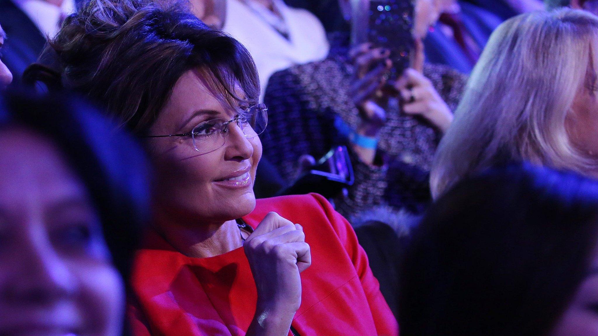 Sarah Palin listening to debates