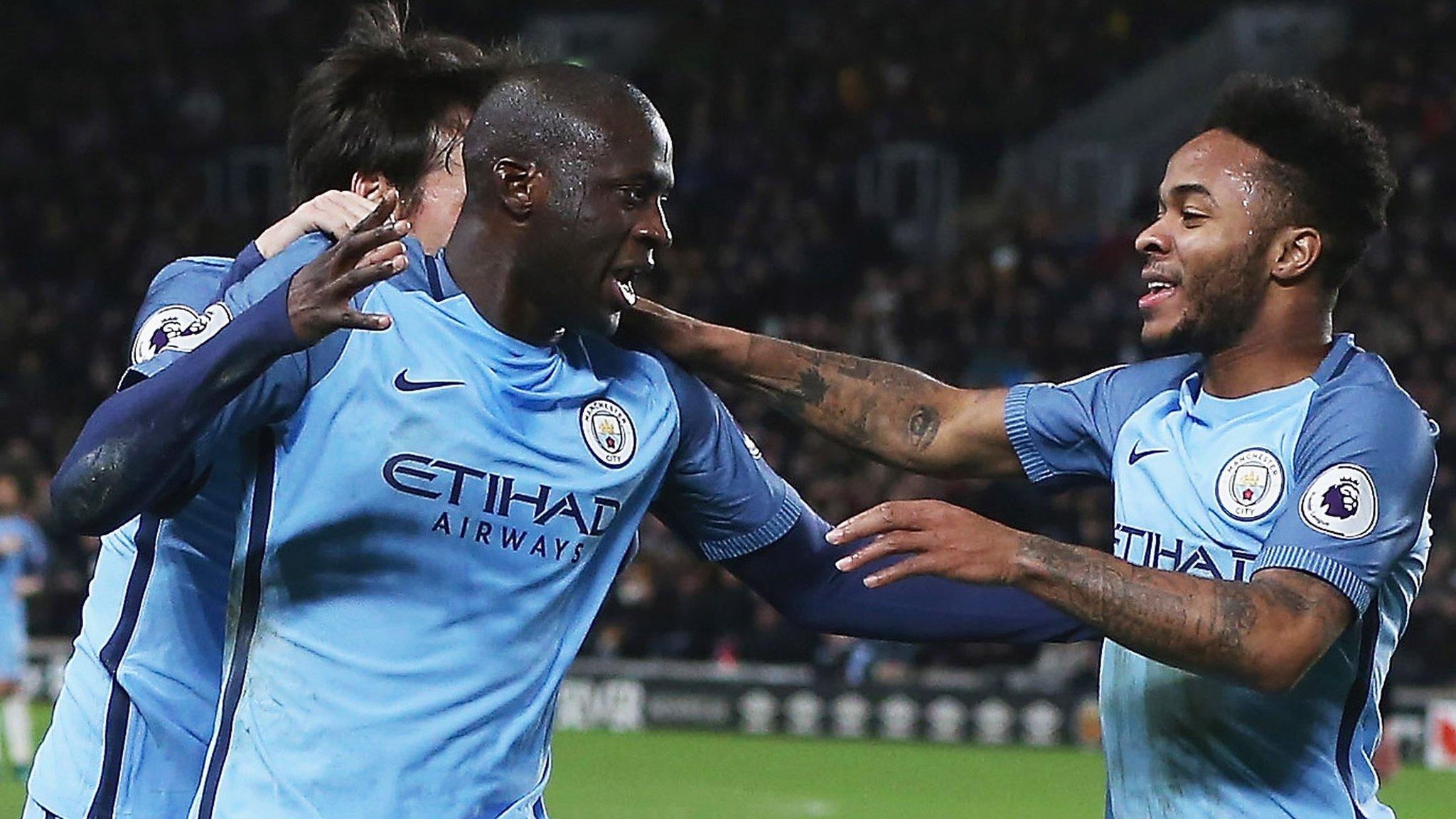 Yaya Toure of Manchester City celebrates scoring the opening goal with Raheem Sterling