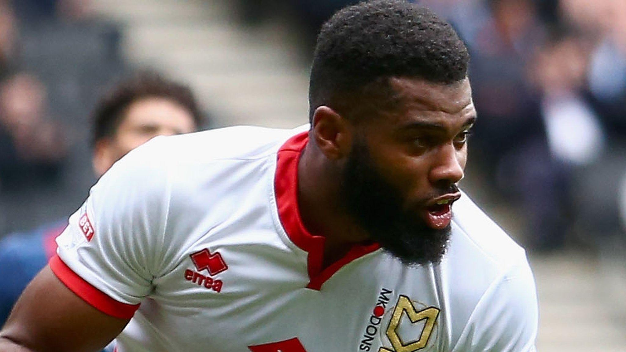 Ethan Ebanks-Landell of Milton Keynes Dons celebrates scoring