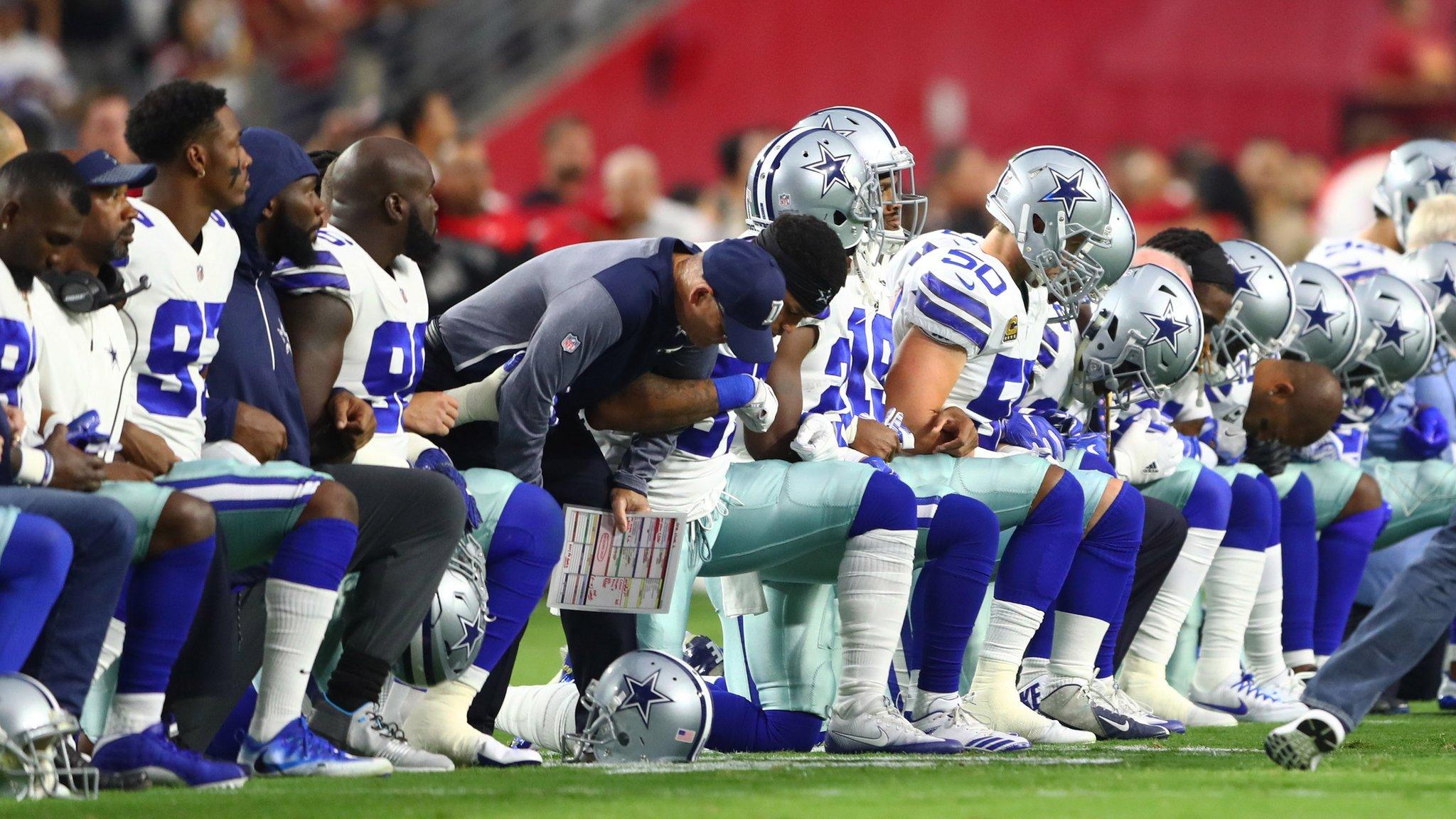 Dallas Cowboys players kneeling