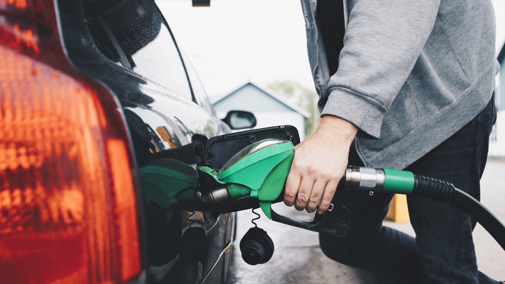 Man refueling car at fuel station