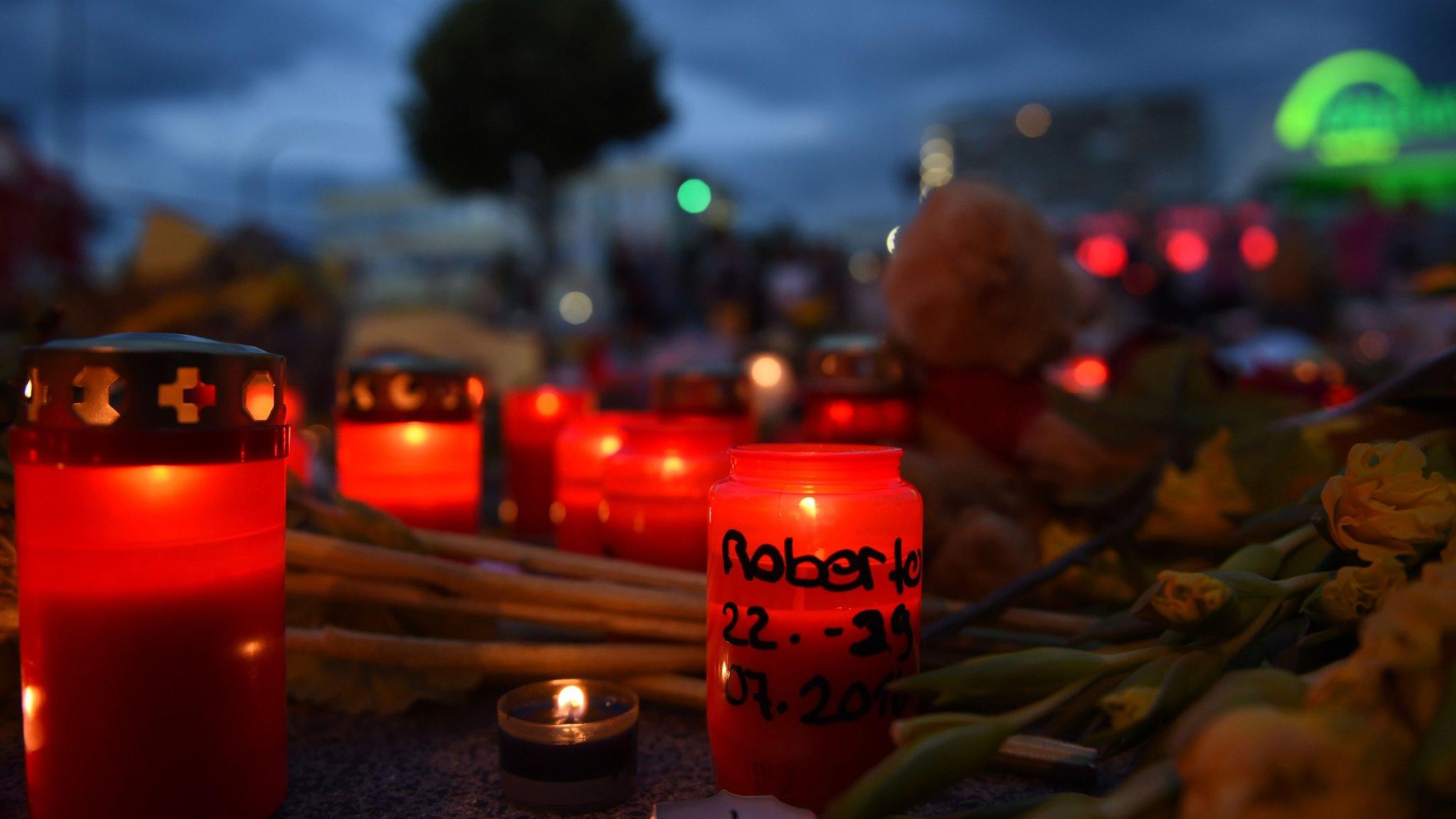 Flowers and candles near the Olympia shopping centre on July 24, 2016