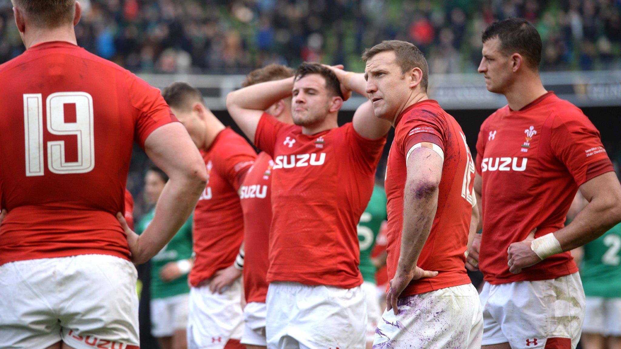 Wales' players look dejected at full time