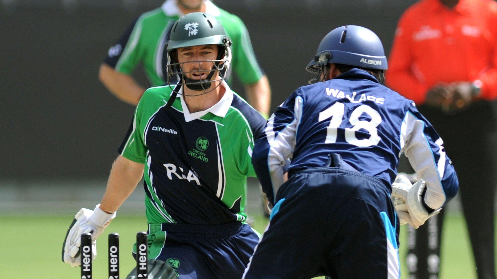 Ireland's Alex Cusack is stumped by Scotland's Craig Wallace