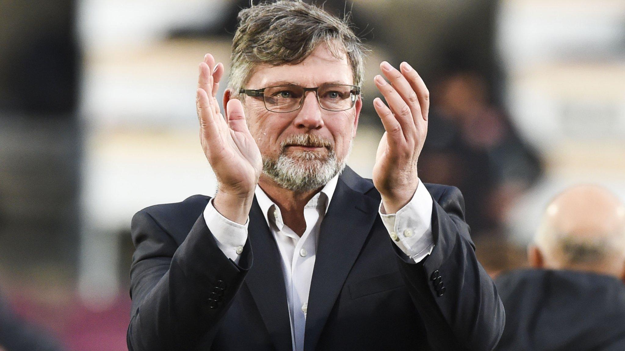 Hearts boss Craig Levein applauds his players after their win over Celtic