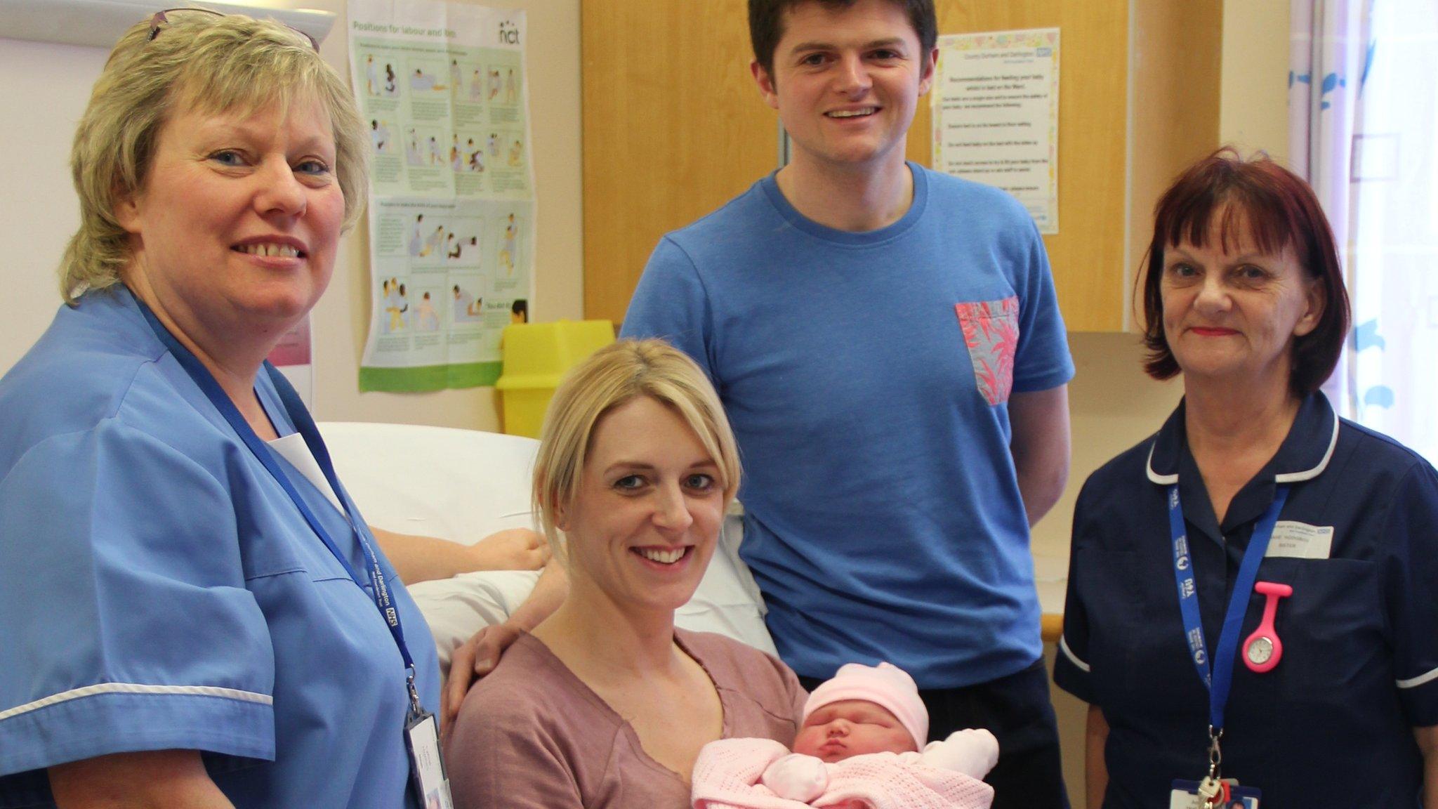 Baby Sienna, with parents and hospital staff