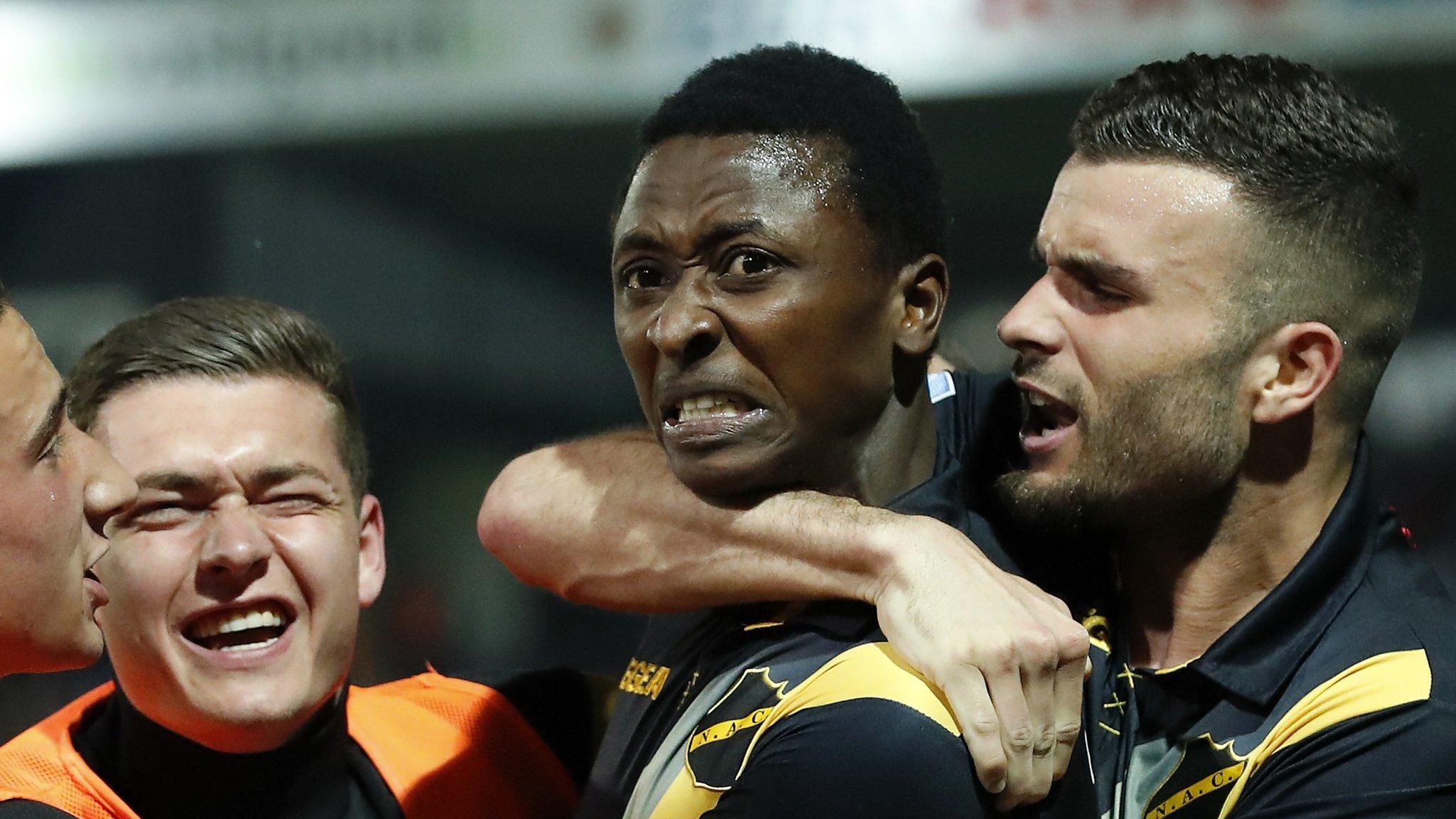 Umar Sadiq (centre) celebrates with Breda