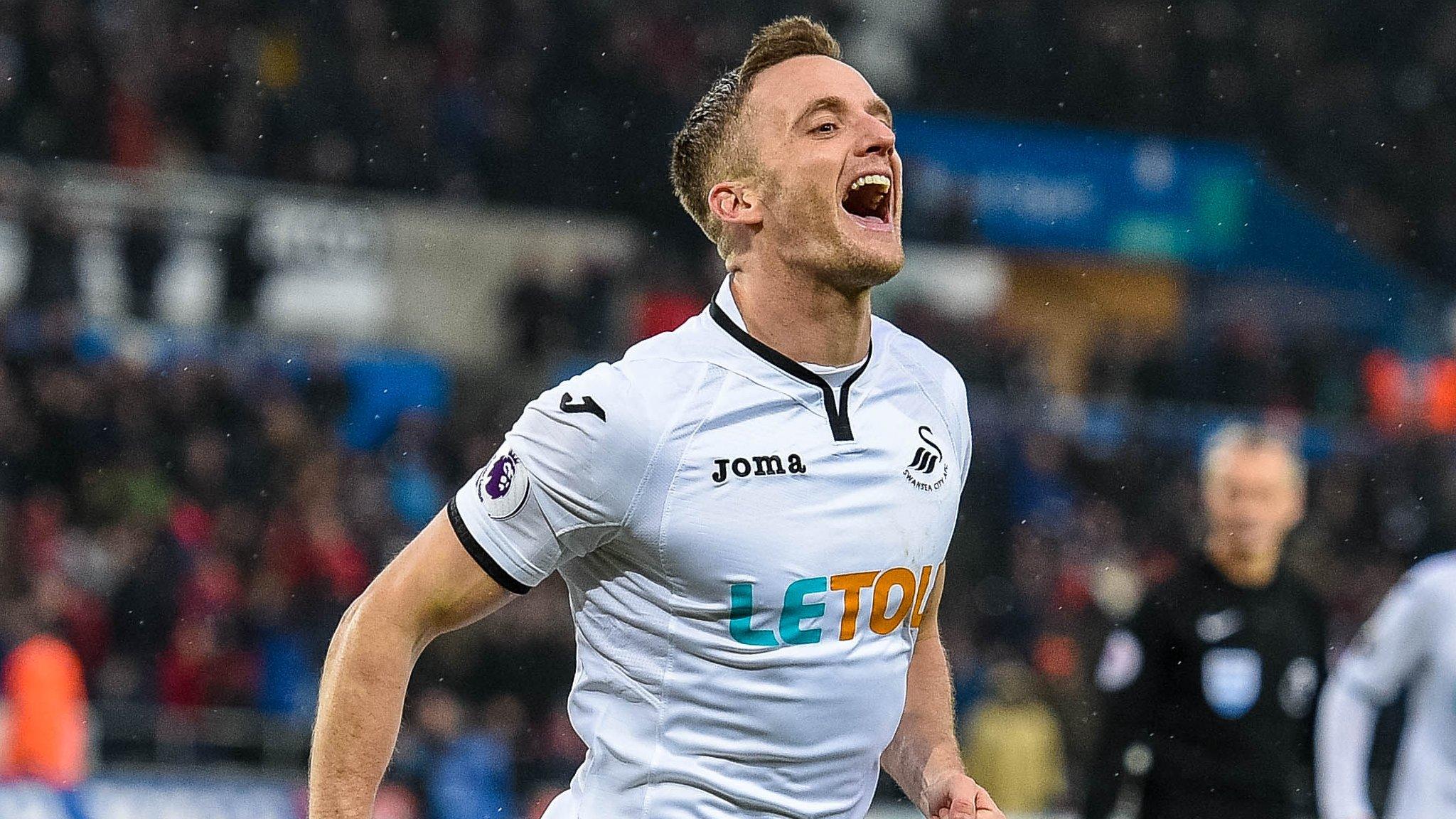 Andy King celebrates a goal