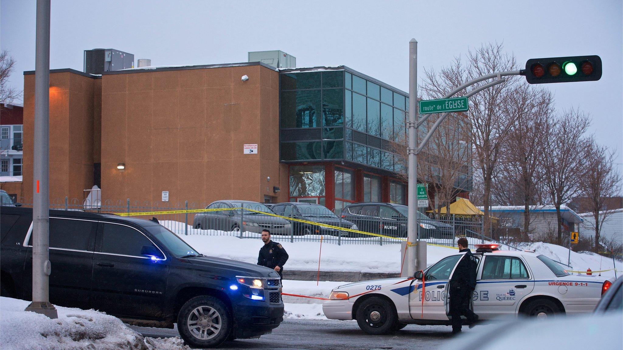 Municipal police patrols outside the Quebec Mosque