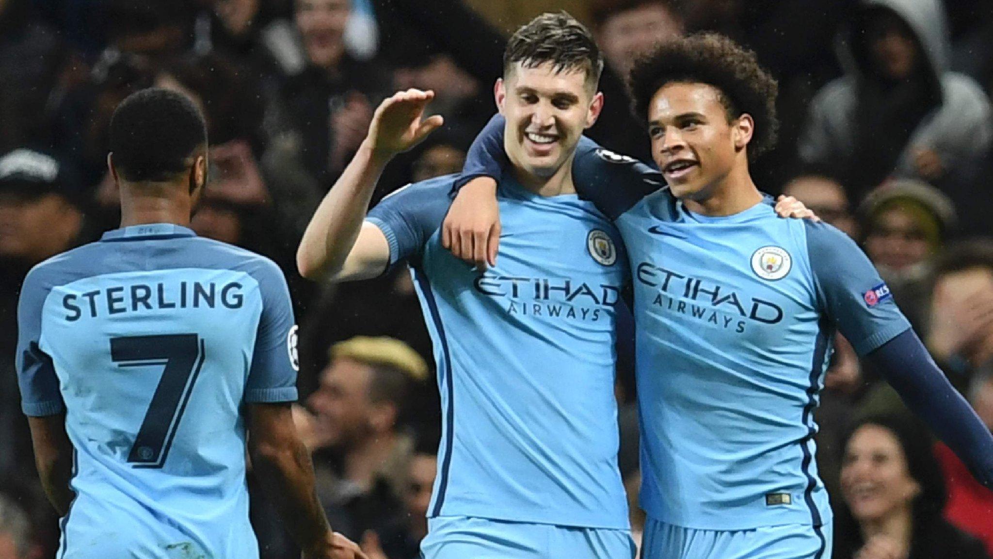 Raheem Sterling celebrates with John Stones