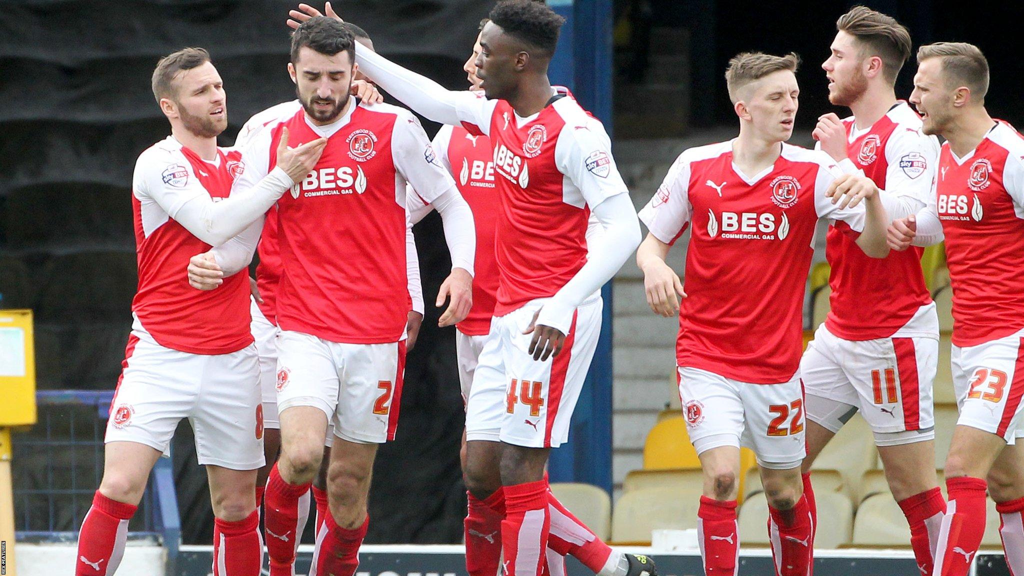 Fleetwood players celebrate Conor McLaughlin's late equaliser