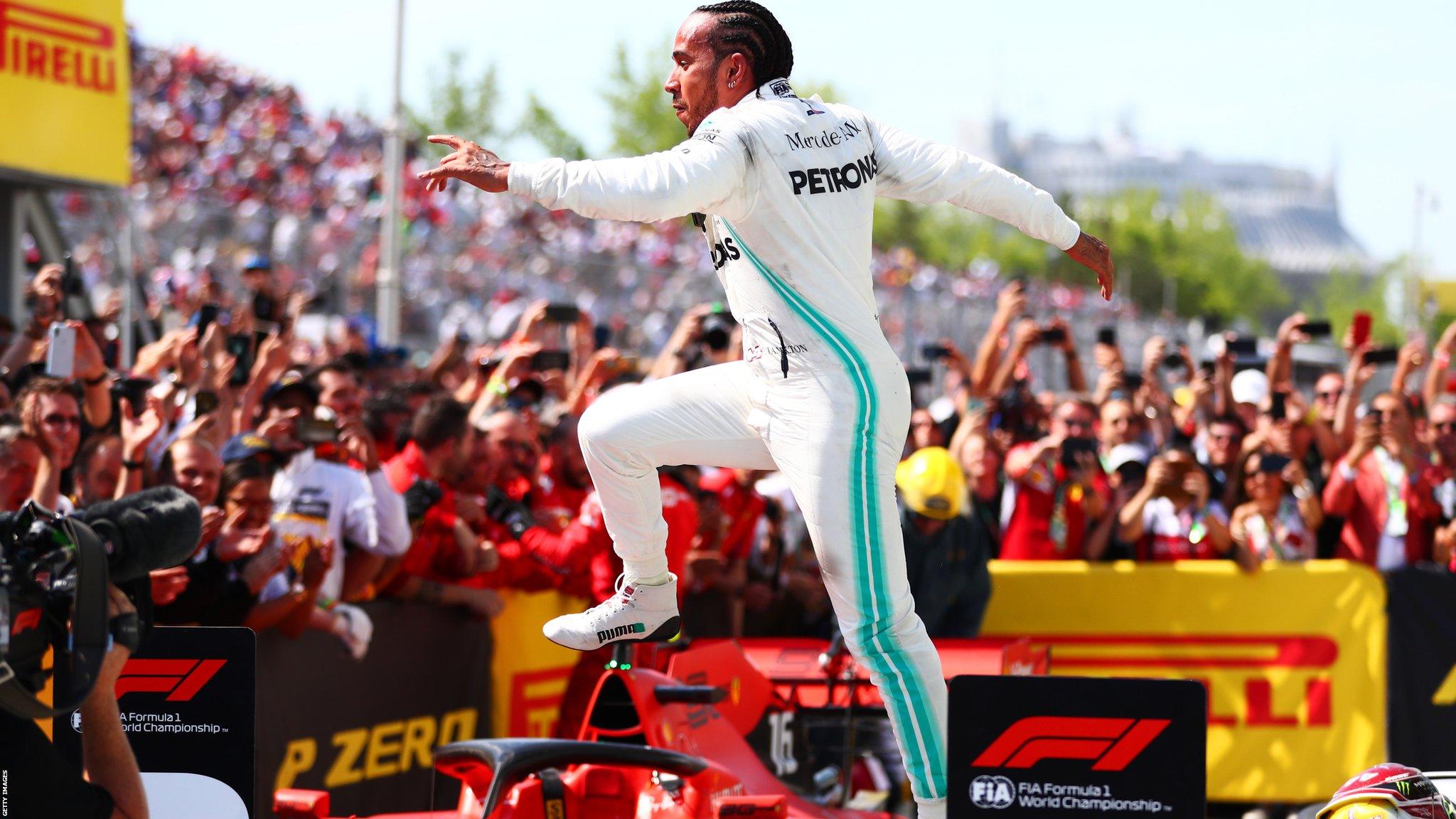 Lewis Hamilton jumps over the Ferrari of Sebastian Vettel