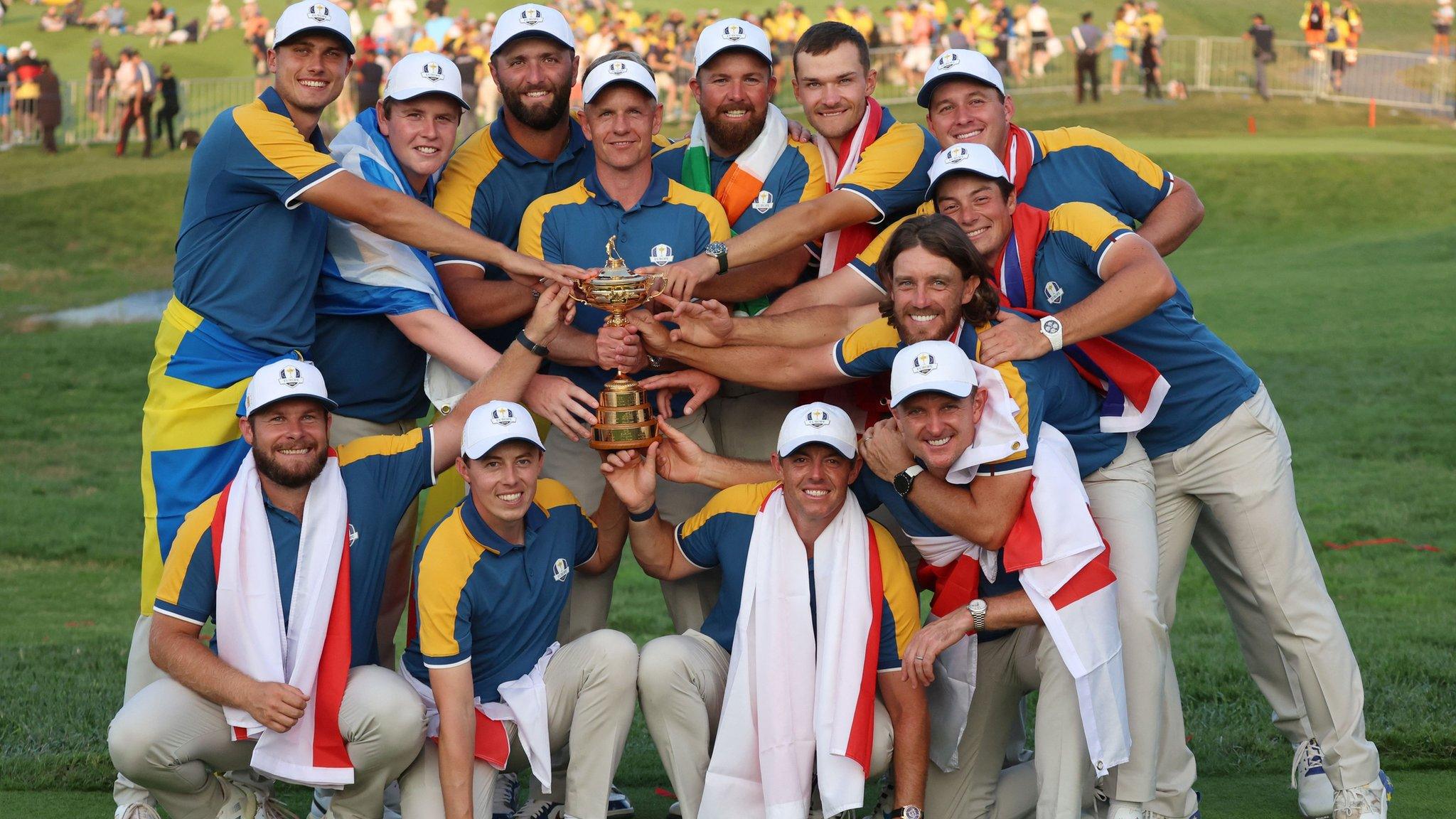 Europe captain Luke Donald and his celebrating players pose for a picture with the Ryder Cup