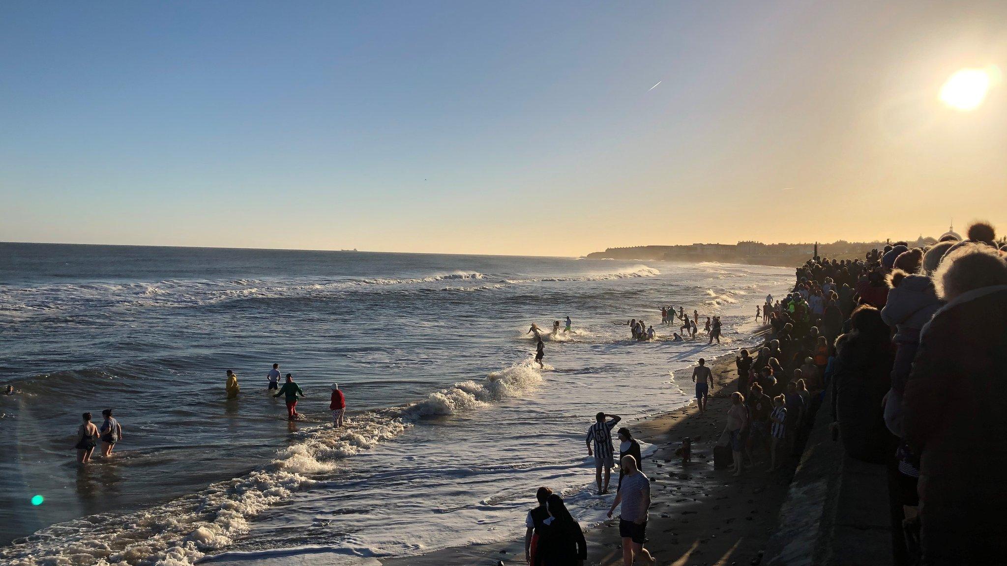 People taking part in a New Year's Day dip at Whitley Bay, North Tyneside