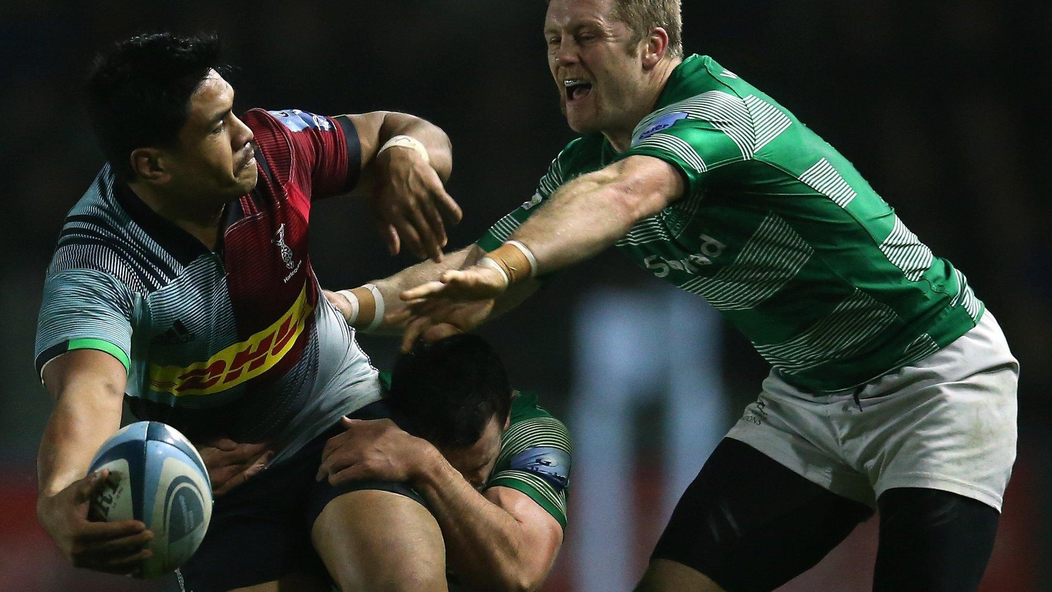 Ben Tapuai of Harlequins is tackled by John Hardie and Alex Tait of Newcastle Falcons