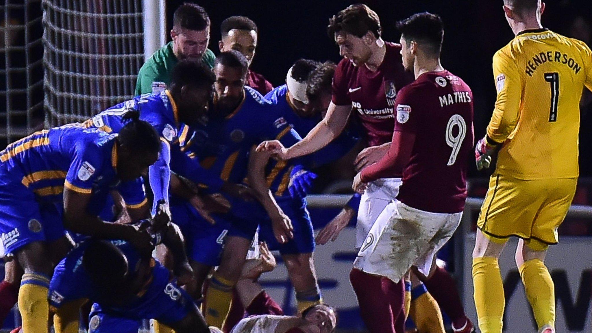 Northampton and Shrewsbury players involved in a melee