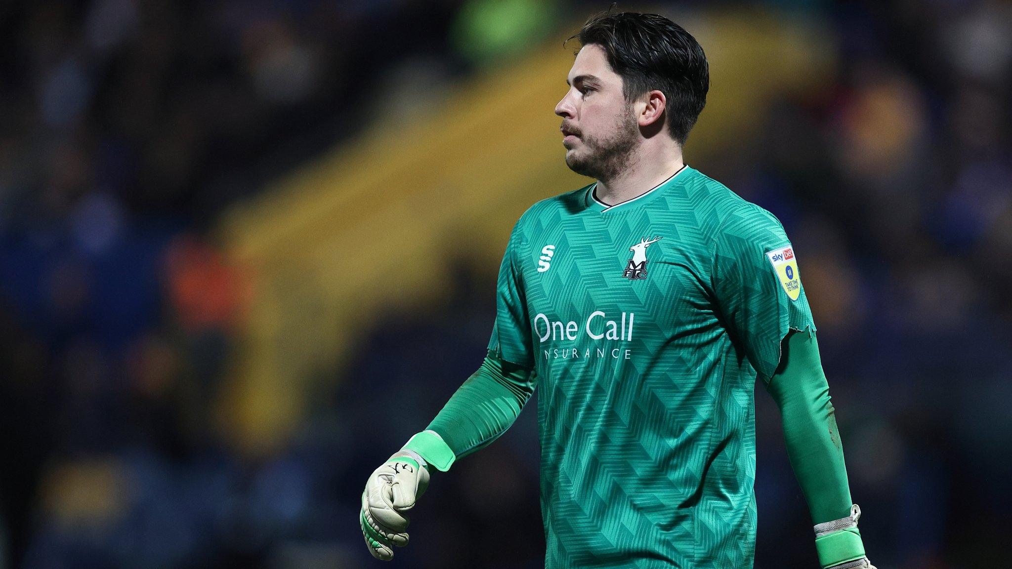 Mansfield's Christy Pym made a couple of saves in the penalty shootout against Sheffield Wednesday