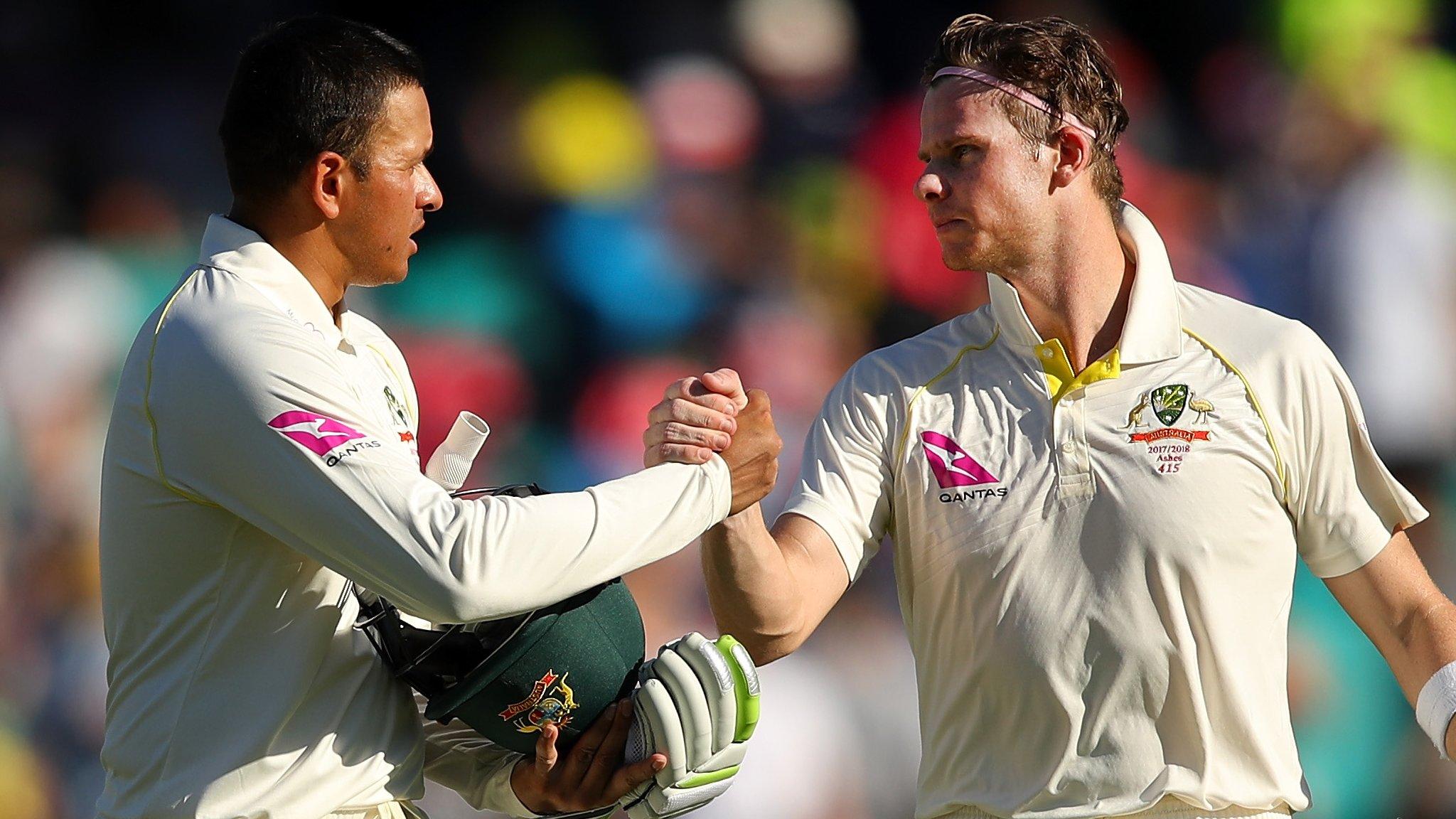 Steve Smith shakes hands with Usman Khawaja