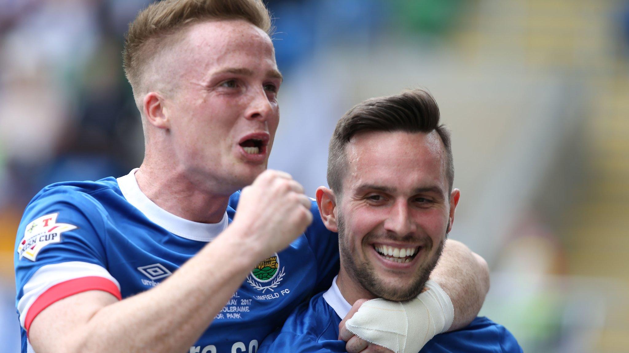 Linfield's Aaron Burns celebrates with two-goal hero Andrew Waterworth