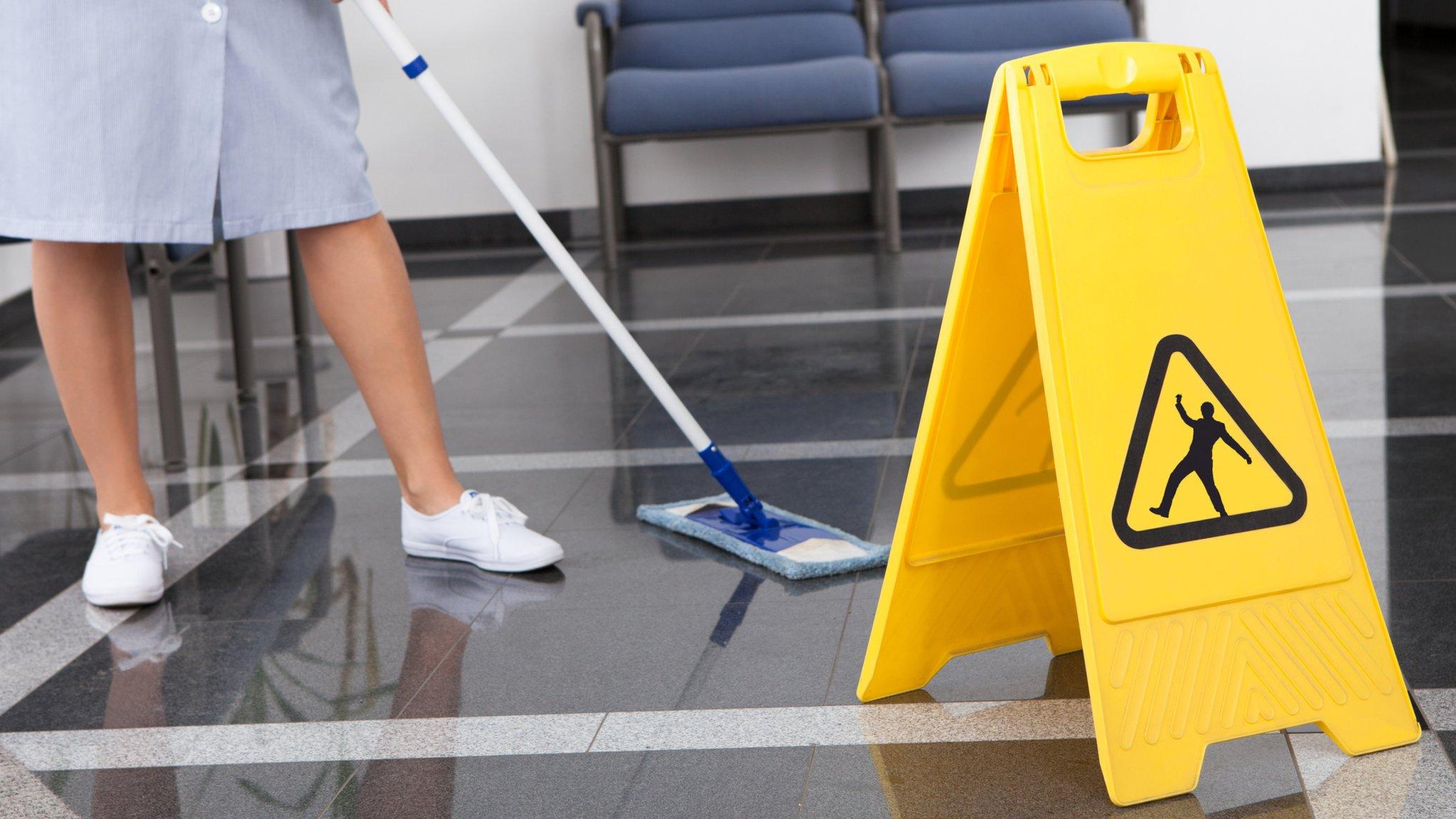 woman mopping floor