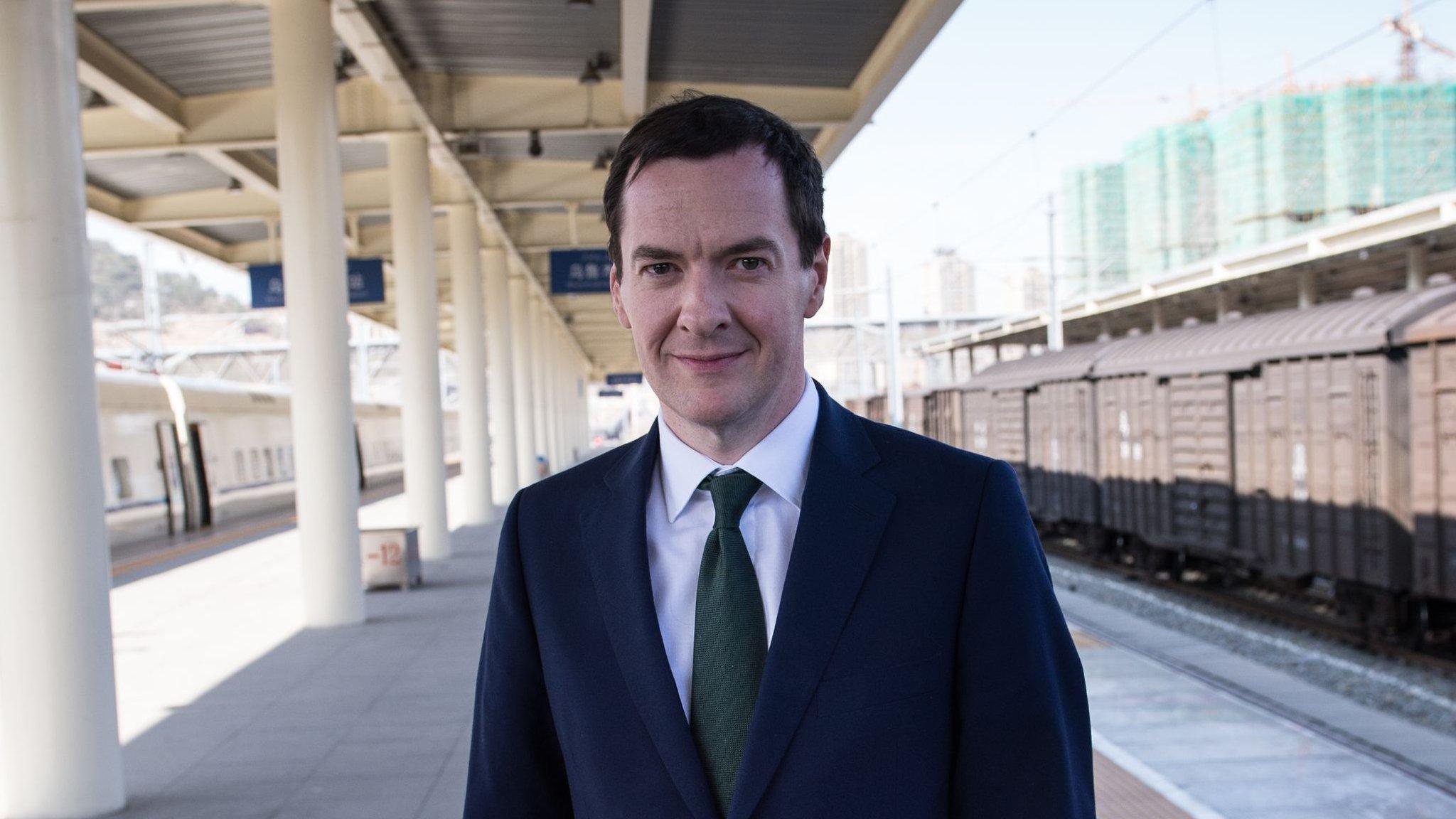 Chancellor of the Exchequer, George Osborne prepares to board a train from the city of Urumqi in north west China to Turpan, 23 September 2015