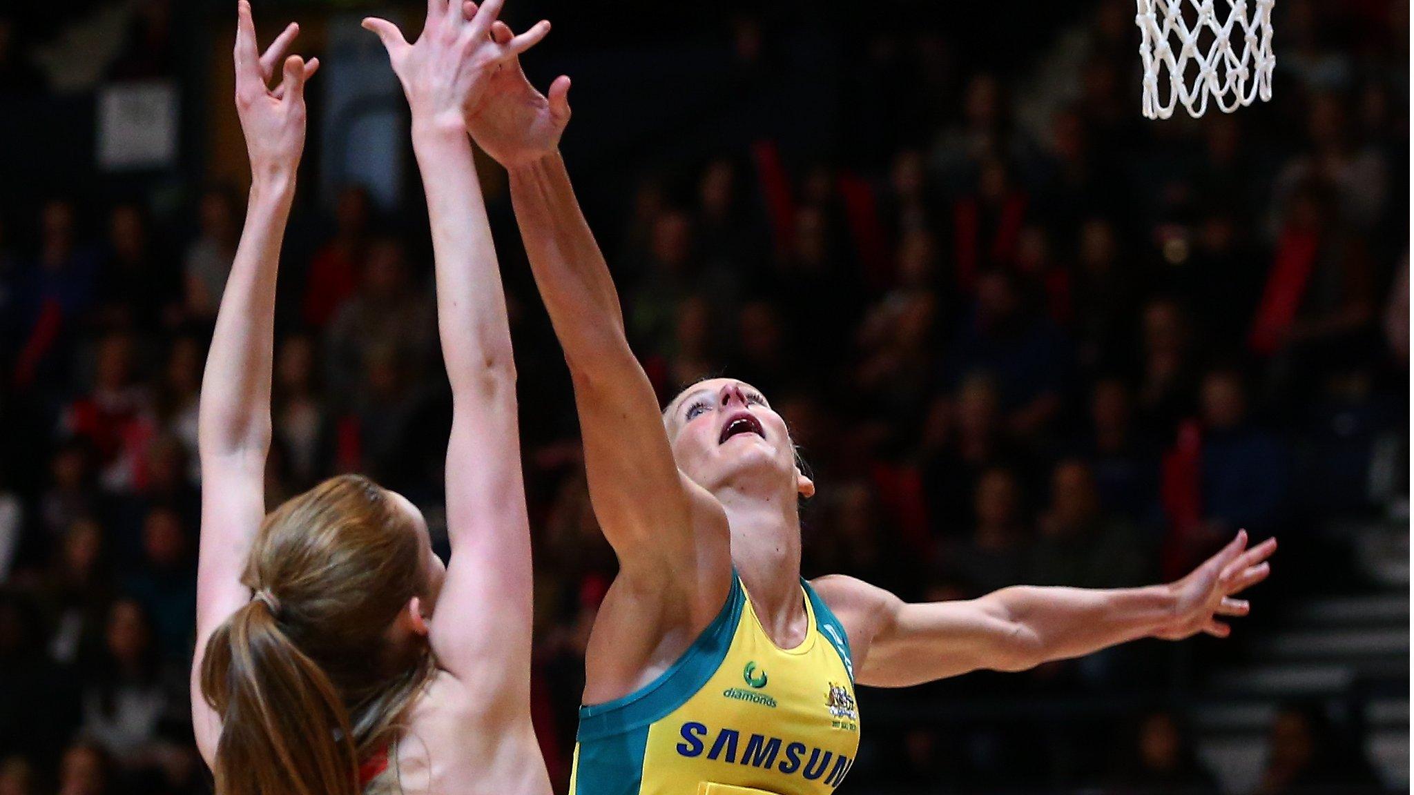 Helen Housby of England shoots past April Brandley of Australia