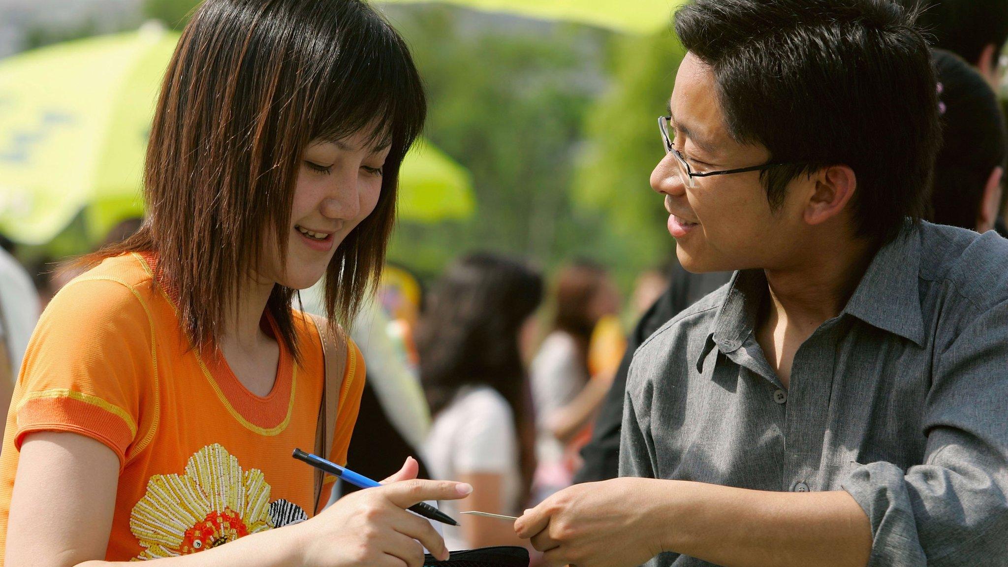 Singles attend a singles party at the Pudong Century Park on May 20, 2006 in Shanghai, China.