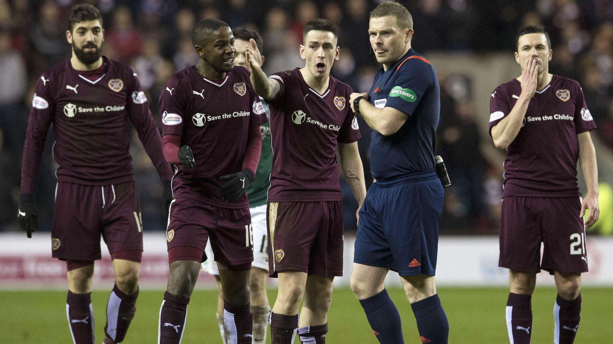 Hearts players remonstrate with John Beaton after Blazej Augustyn was dismissed