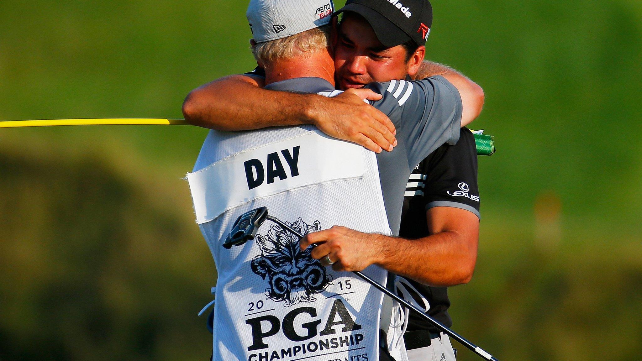 Jason Day with his caddie after winning his first major