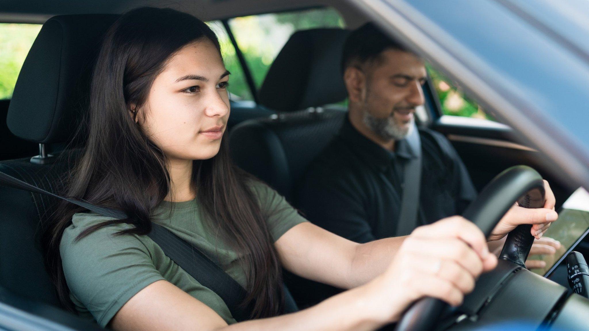 A woman learns to drive