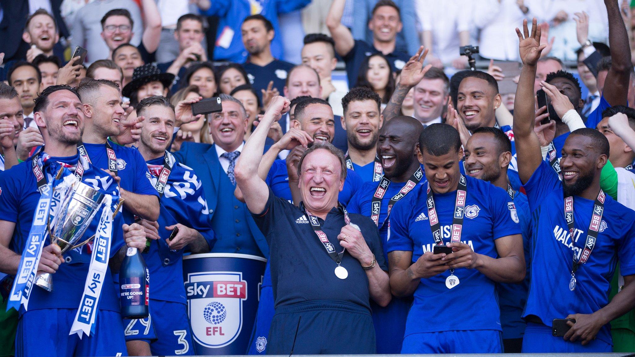 Manager Neil Warnock celebrates with his Cardiff players