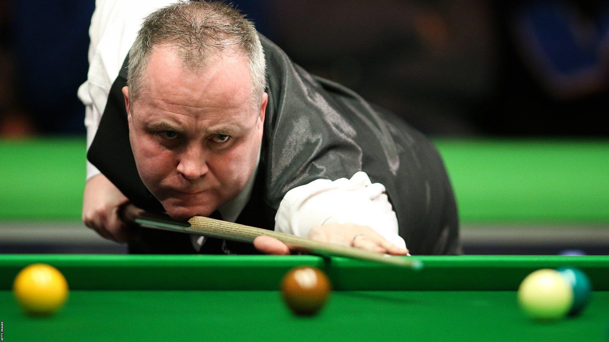 John Higgins plays a shot at the recent UK Championship