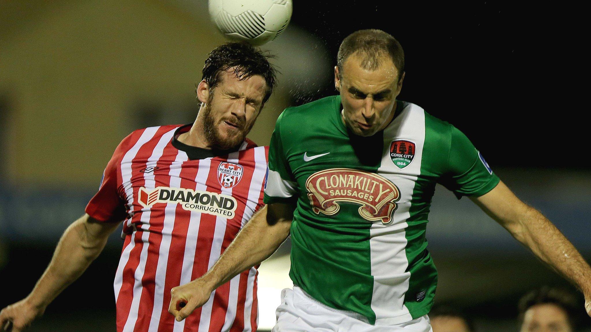 Derry defender Ryan McBride and Cork's Dan Murray contest a high ball