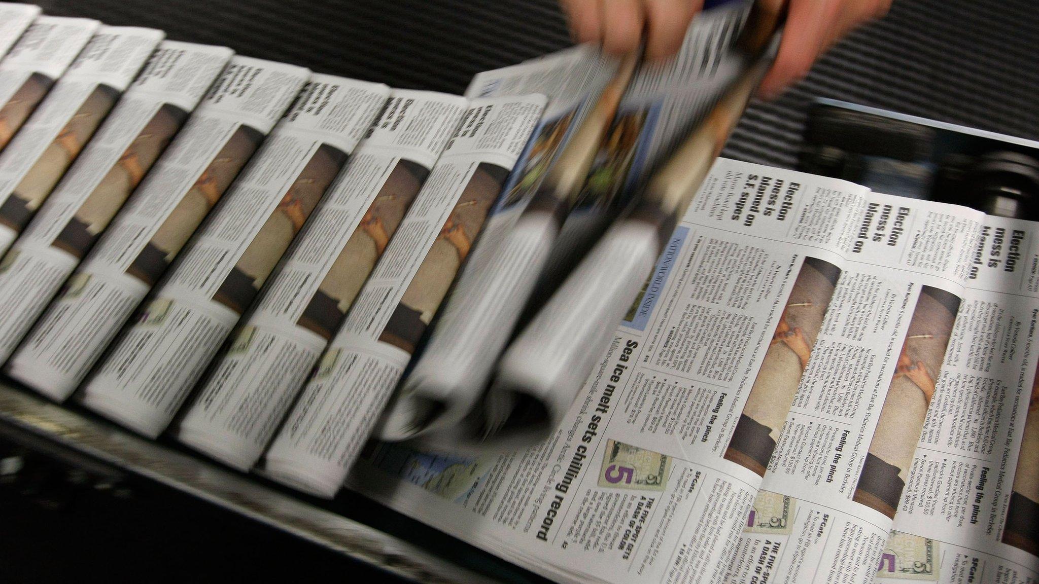 newspapers on a rack from 2007