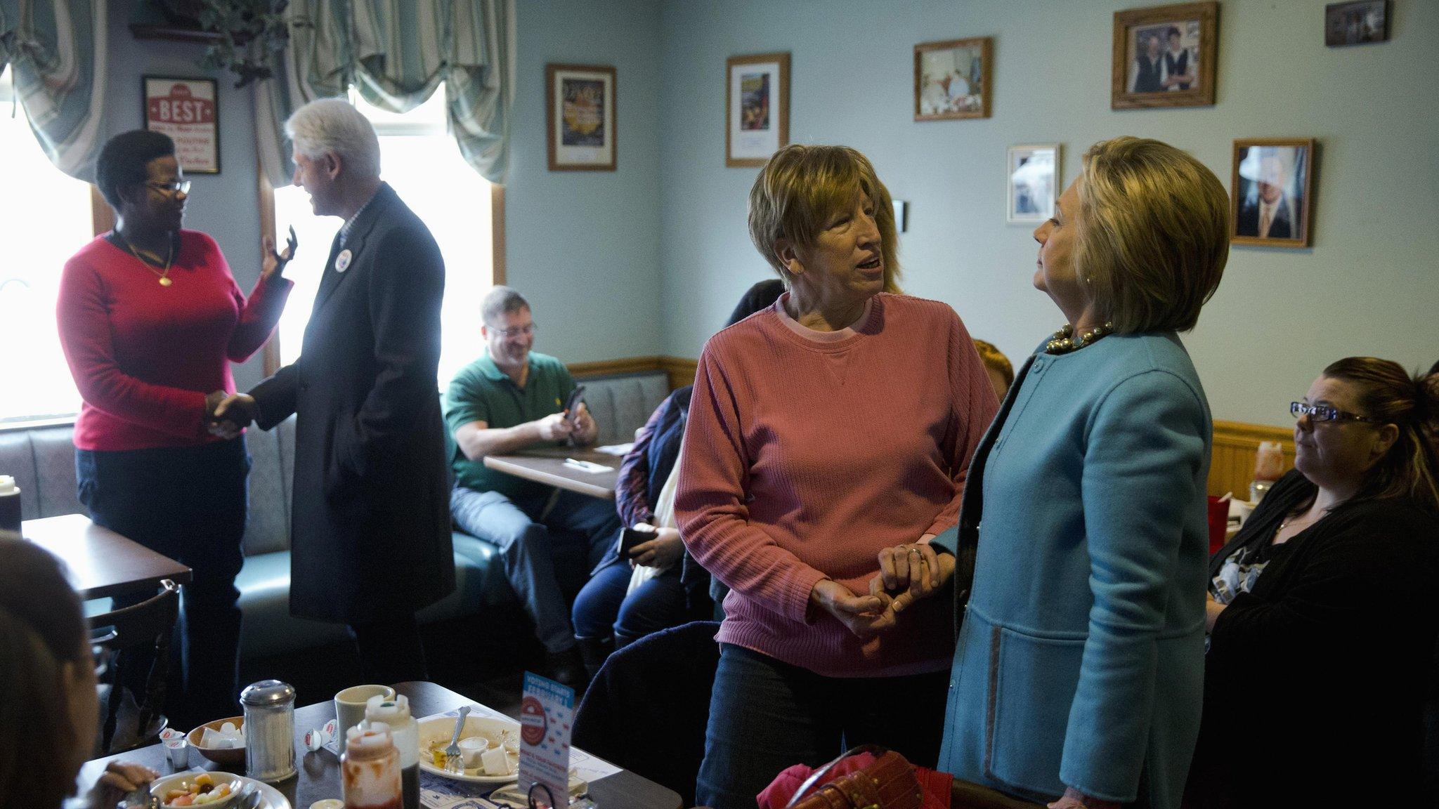 Hillary and Bill Clinton meet voters in a New Hampshire diner