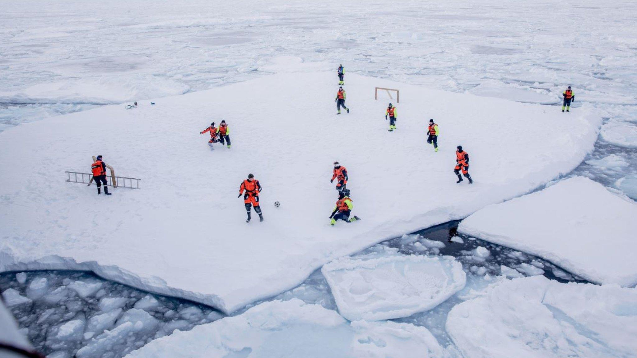 Norwegian Coast Guard of crew members of Norwegian Coast Guard icebreaker KV Svalbard getting a once in a lifetime experience while playing soccer on an ice floe in the arctic environment in the sea around 2018 (issued 28 March 2018)