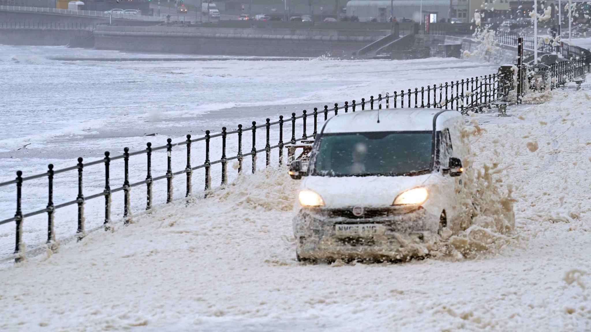 Van drives through sea foam in Seaburn