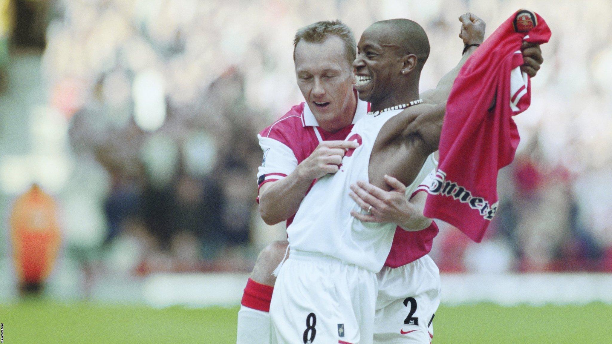 Ian Wright celebrates scoring a goal for Arsenal