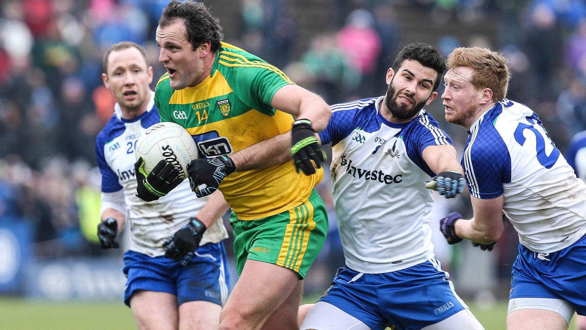 Donegal forward Michael Murphy is challenged by Monaghan's Neil McAdam