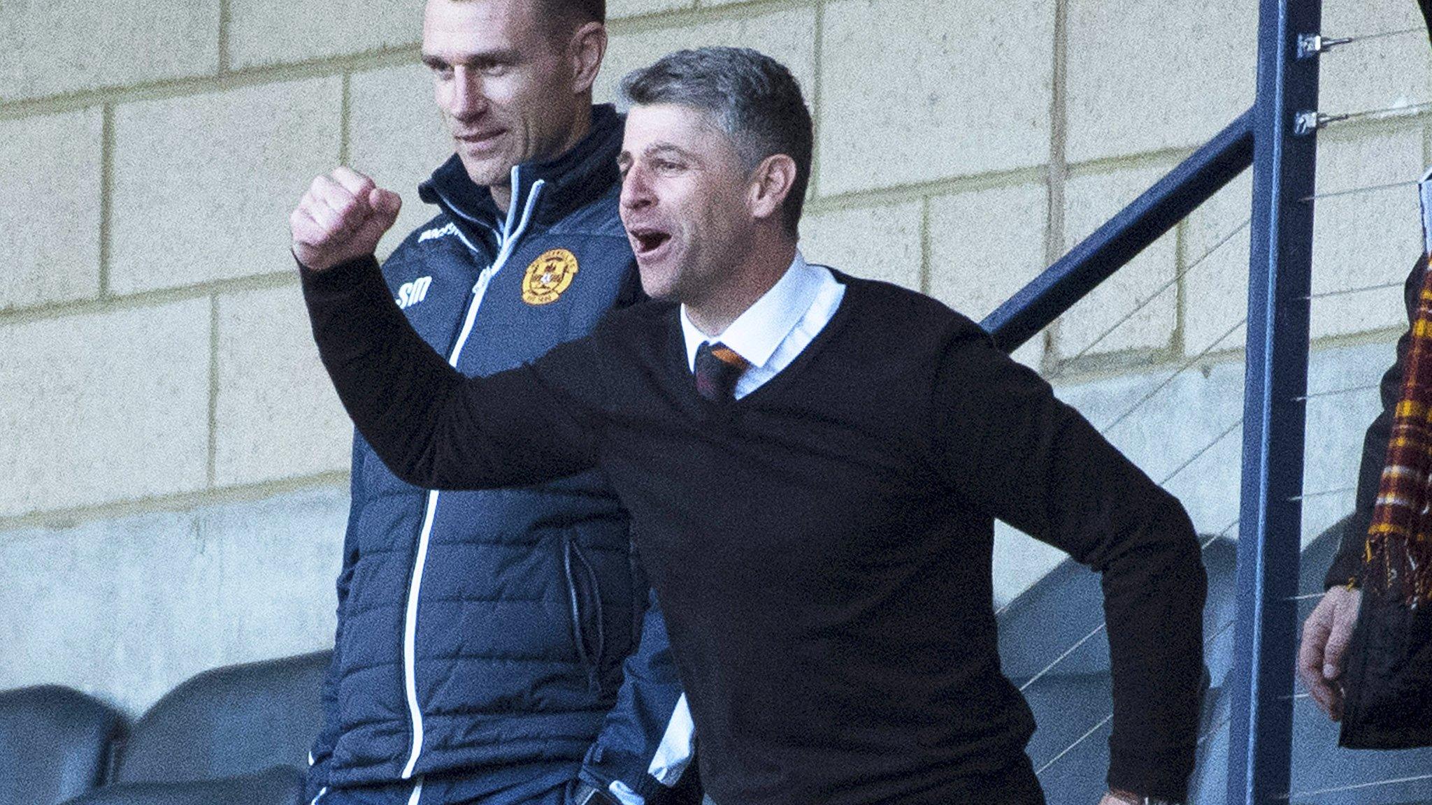 Stephen Robinson celebrates Louis Moult's second goal from the stands at Hampden