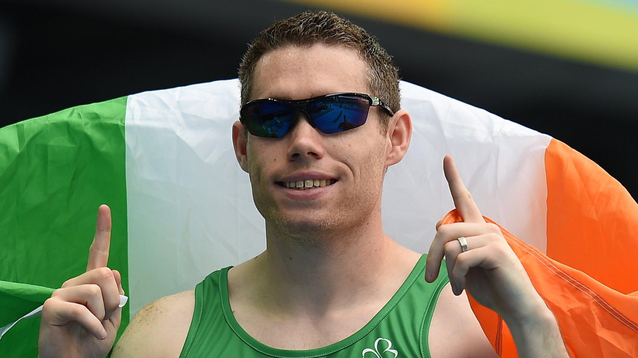 Jason Smyth celebrates after winning a third successive T13 100m title