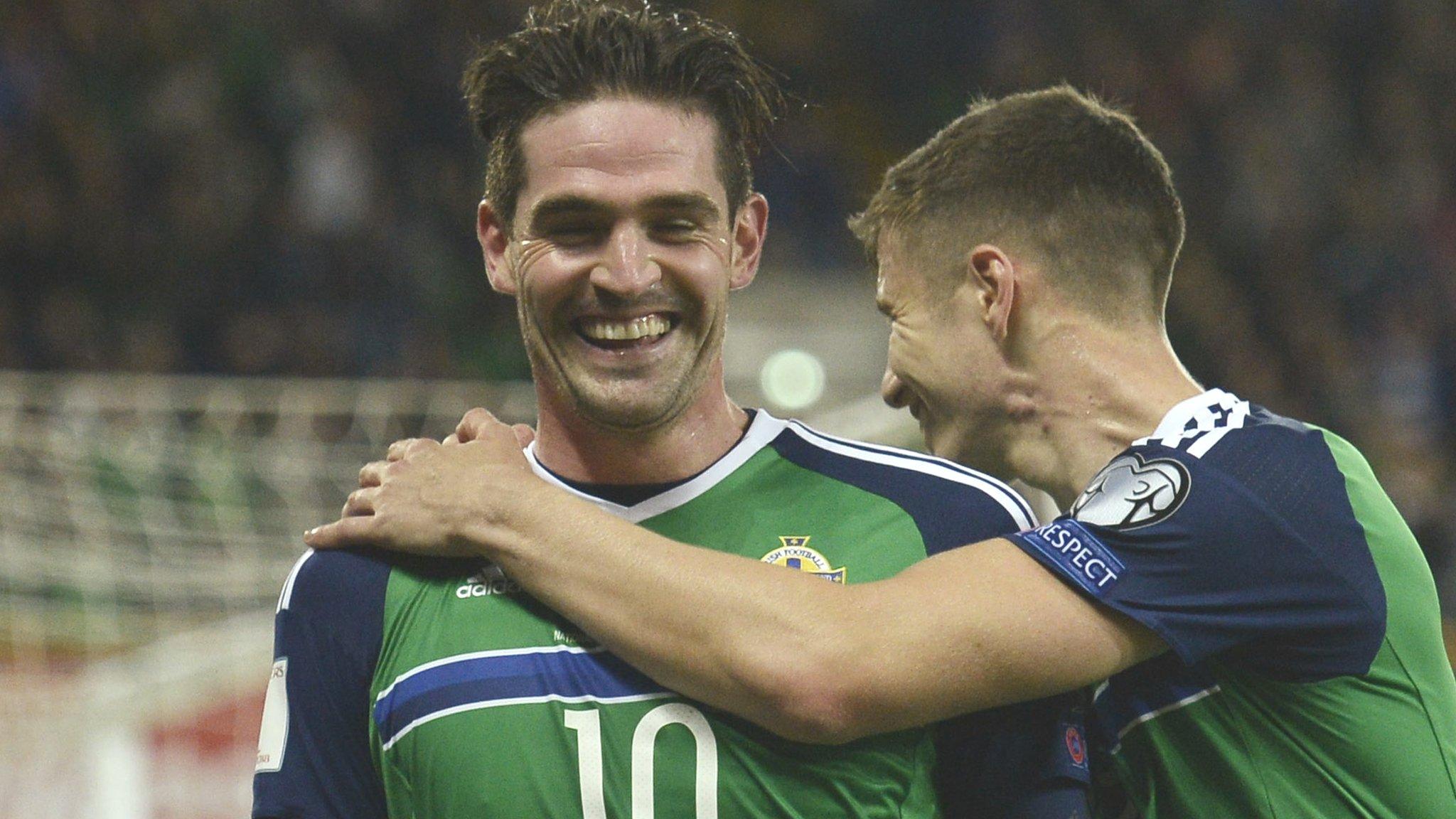 Northern Ireland goalscorer Kyle Lafferty is congratulated by Paddy McNair